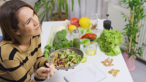 healthy eating woman makes vegetable diet. eating salad.