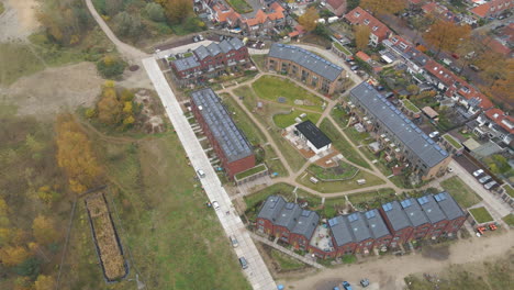 aerial overview of a new suburban neighborhood with solar panels on rooftop