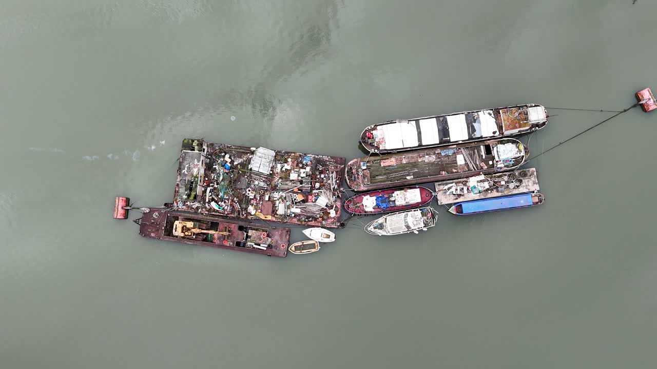 Waste barges on River Medway Kent uk Overhead birds eye drone aerial 4K