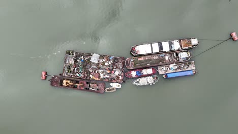 waste barges on river medway kent uk overhead birds eye drone aerial 4k