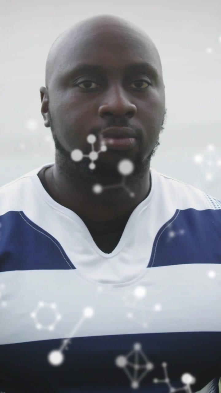 Animation of chemical structures over male rugby players at stadium