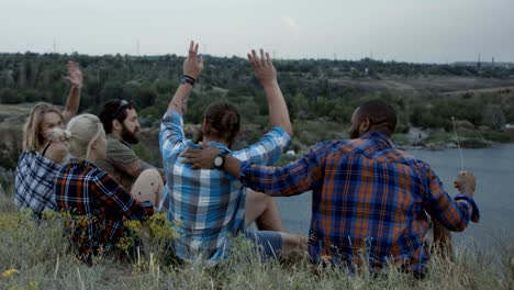 diverse people taking rest in nature and chatting