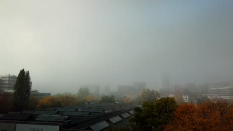 bucharest, romania - october 20, 2019 : office buildings in north part of bucharest clouds with fog motion time lapse