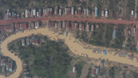 aerial of village on stilts along the tonle sap in cambodia push in