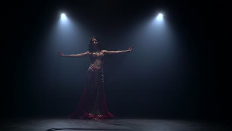 belly dancer performance under spotlight