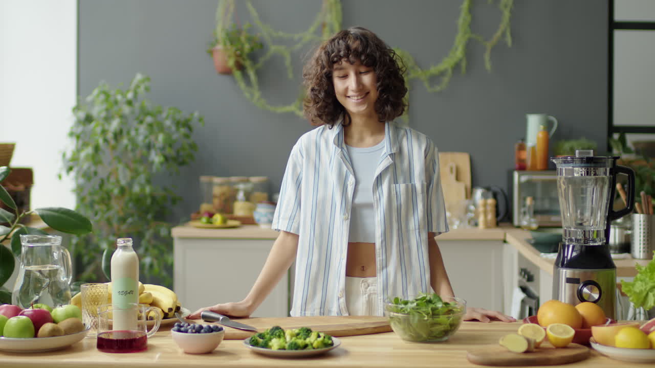 Portrait of Cheerful Woman with Healthy Food Ingredients in Kitchen