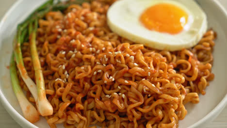 homemade dried korean spicy instant noodles with fried egg