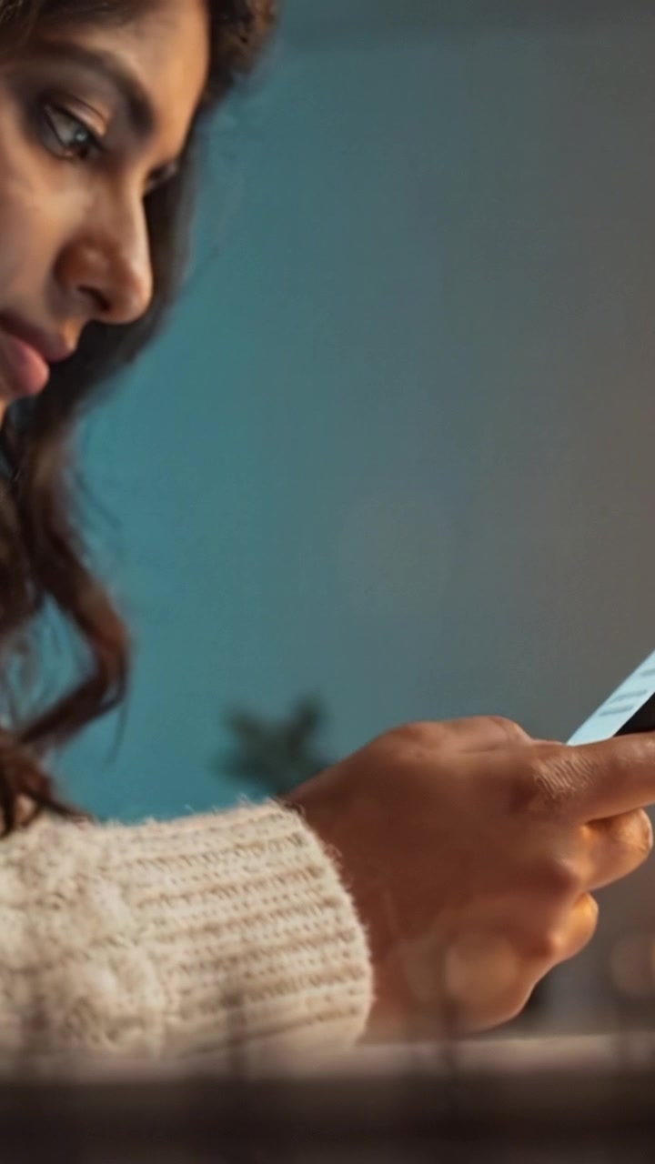 A Young Woman Interacting with a Smartphone in a Cozy Environment, Capturing the Intimacy of Modern Digital Communication and Connection in Daily Life