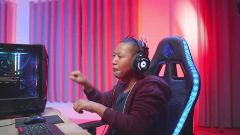 teenager celebrating a victory in a video game