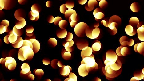 partículas de bokeh amarillo rojizo brillantes y calientes sobre un fondo negro