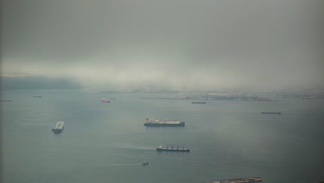 moody foggy day over port of gibraltar, time lapse view