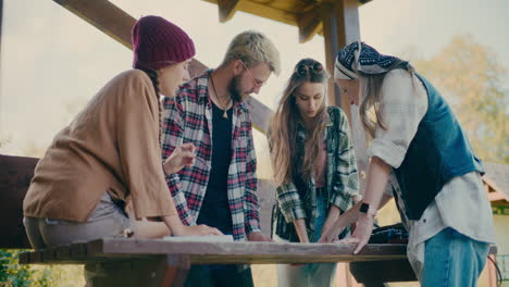 Male-And-Female-Friends-Planning-Together-Around-Table