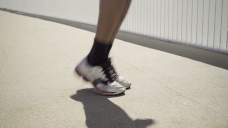 cropped shot of sportsman during jumping rope workout.