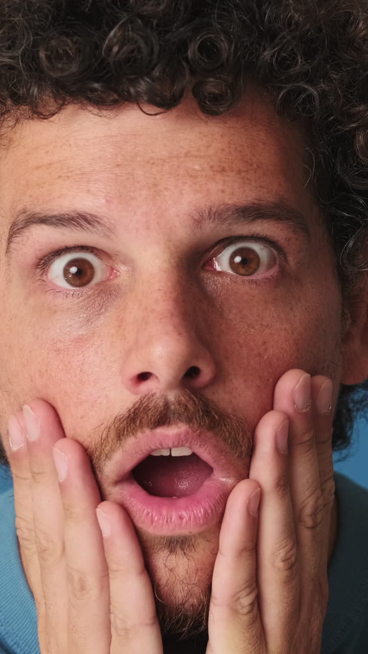 Close-up of Man's Face Expressing Surprise and Awe