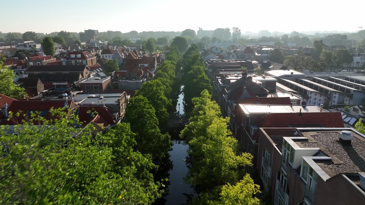 Cityscape with Canal and Tree-Lined Street