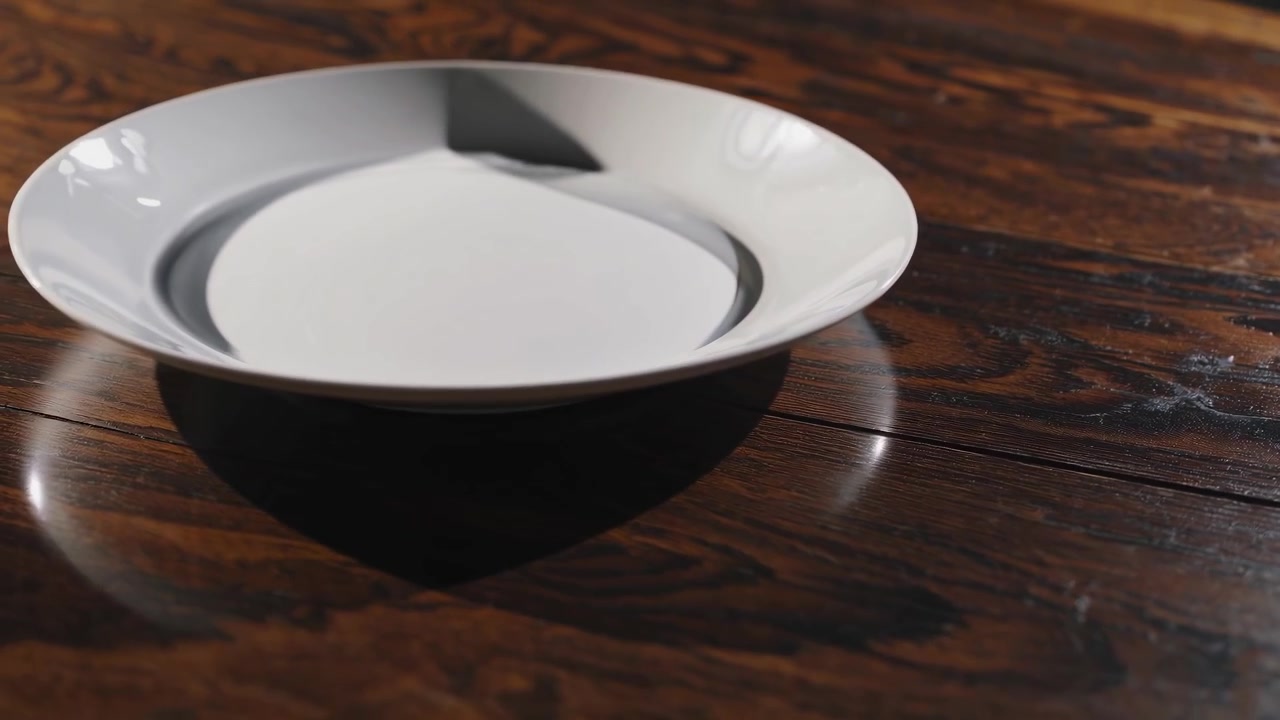 Empty White Plate on a Dark Wooden Table