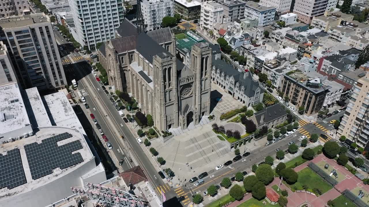 Stunning aerial footage of downtown Los Angeles featuring iconic skyscrapers under clear blue skies. The vibrant urban landscape highlights the city's architectural grandeur