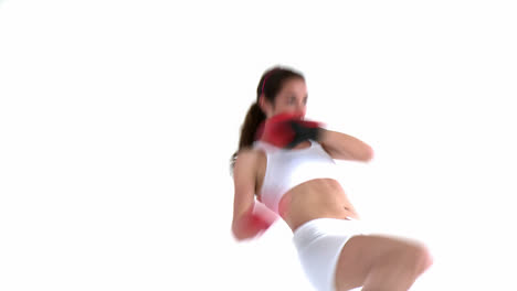 Concentrated-hispanic-woman-wearing-boxing-gloves