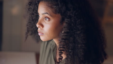 black woman, thinking or working on laptop