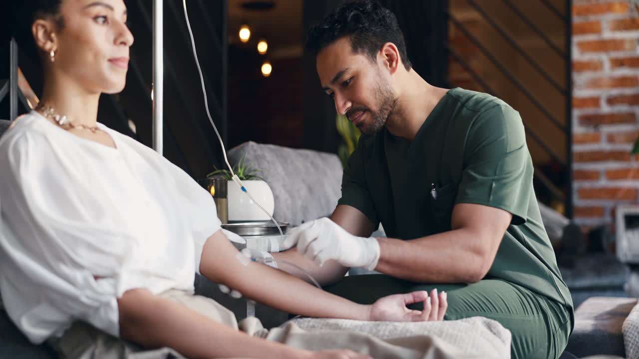 Medical Professional Administering IV Drip to Patient