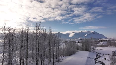snowy peaks of hafnarfjall and surrounding ranges rise above borgarfjörður bay in iceland