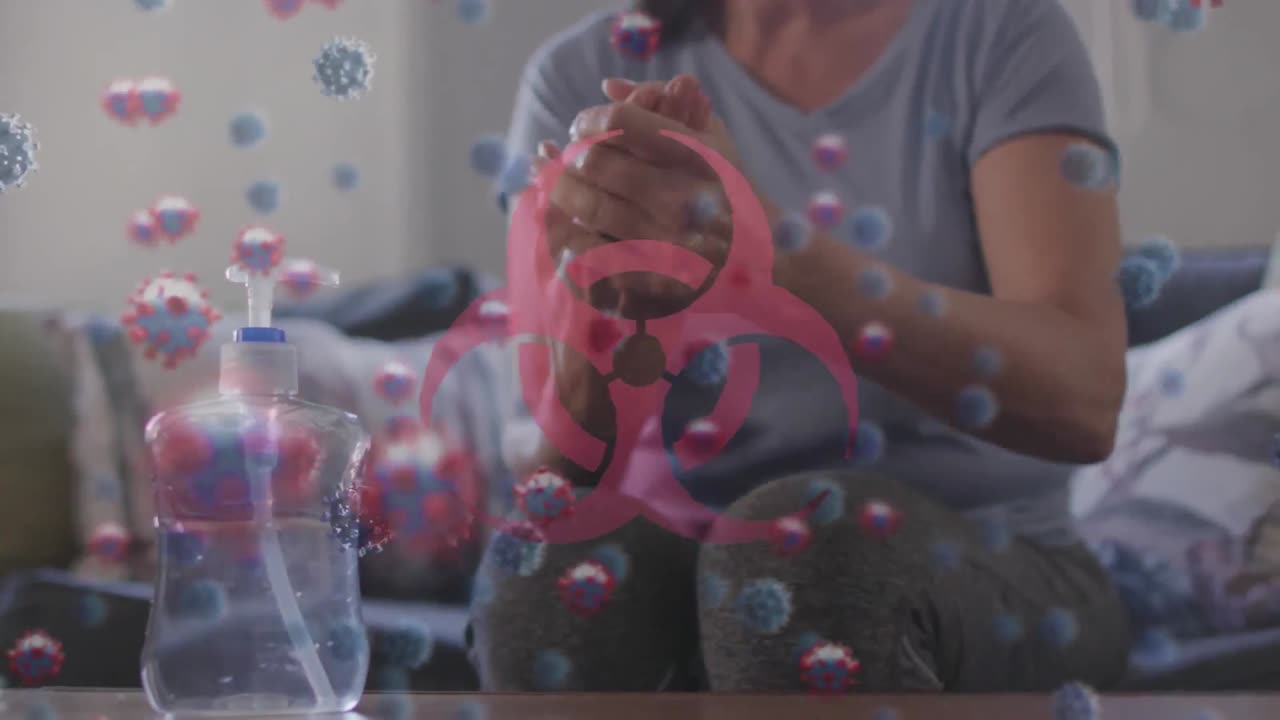 animación de células de covid 19 sobre una persona lavando las manos