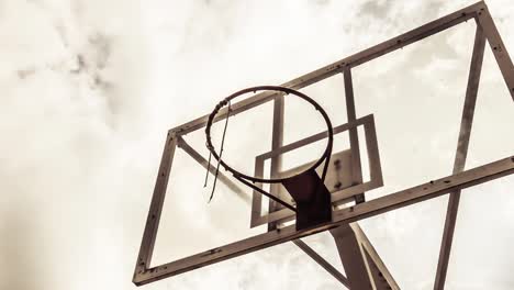 dramatically moving cloud background of a basketball ring in warm color