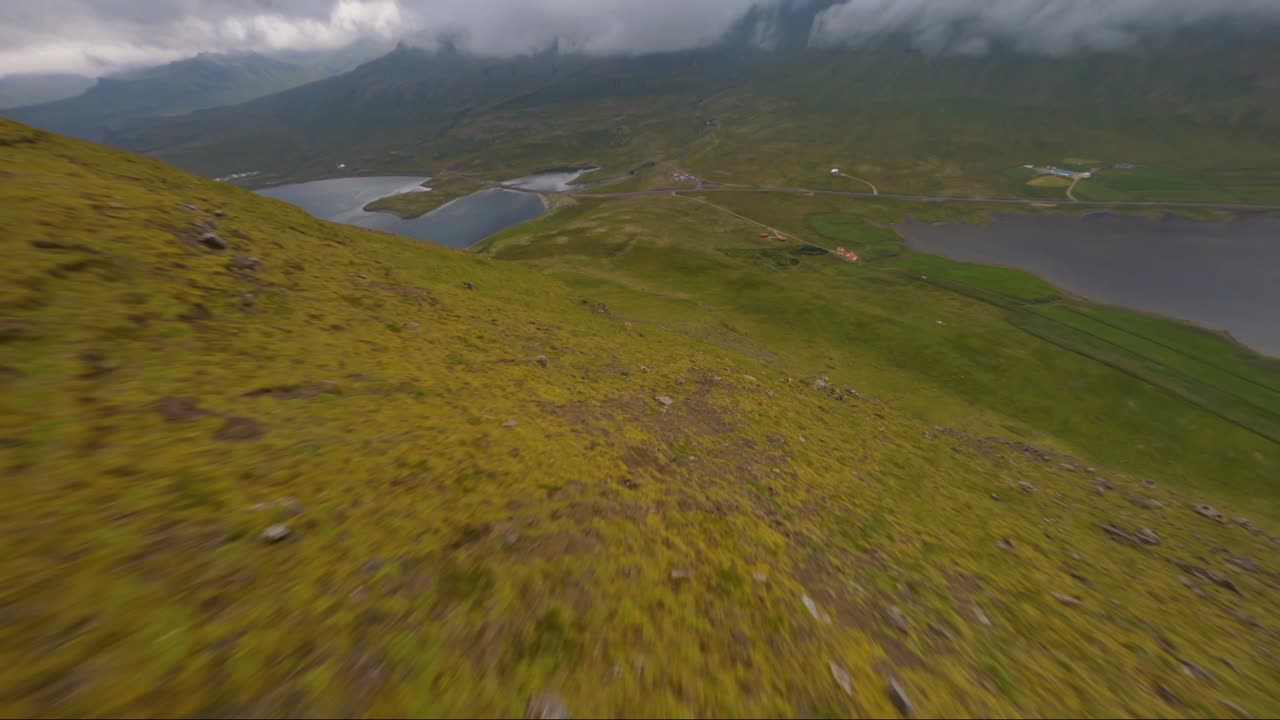 Proximity downhill flight from the peak of the Kirkjufell mountain in Iceland
