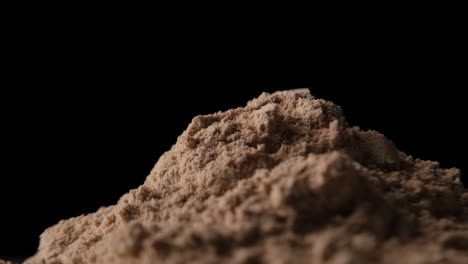protein powder in scoop, close up