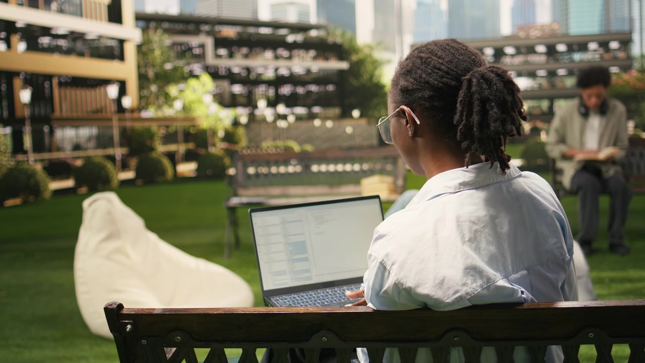 Woman young adult working on binary code programming with laptop screen