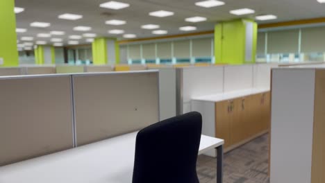 amid the coronavirus pandemic, office floor is silent and empty, desks abandoned