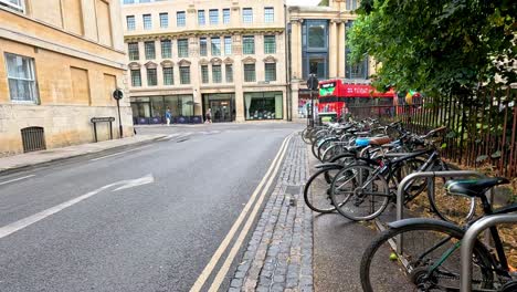 bicycles lined up along a quiet street