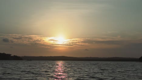 Golden-sun-over-sea-water-at-sunset