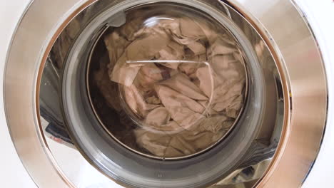Close-up-on-a-washing-machine-with-clothes