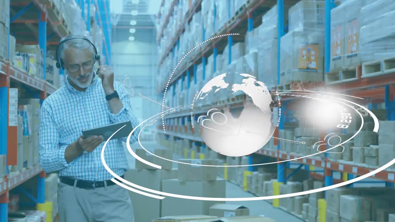 Animation of Caucasian man working in warehouse wearing headset over globe spinning