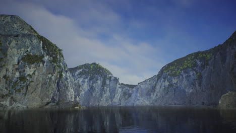 stunning rock formations reflected in calm water under a blue sky