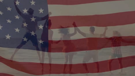 Group-of-people-on-the-beach-with-an-American-flag