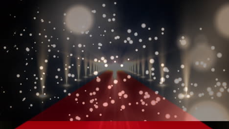 digital composite video of golden glowing spots moving against red carpet with lights flashing