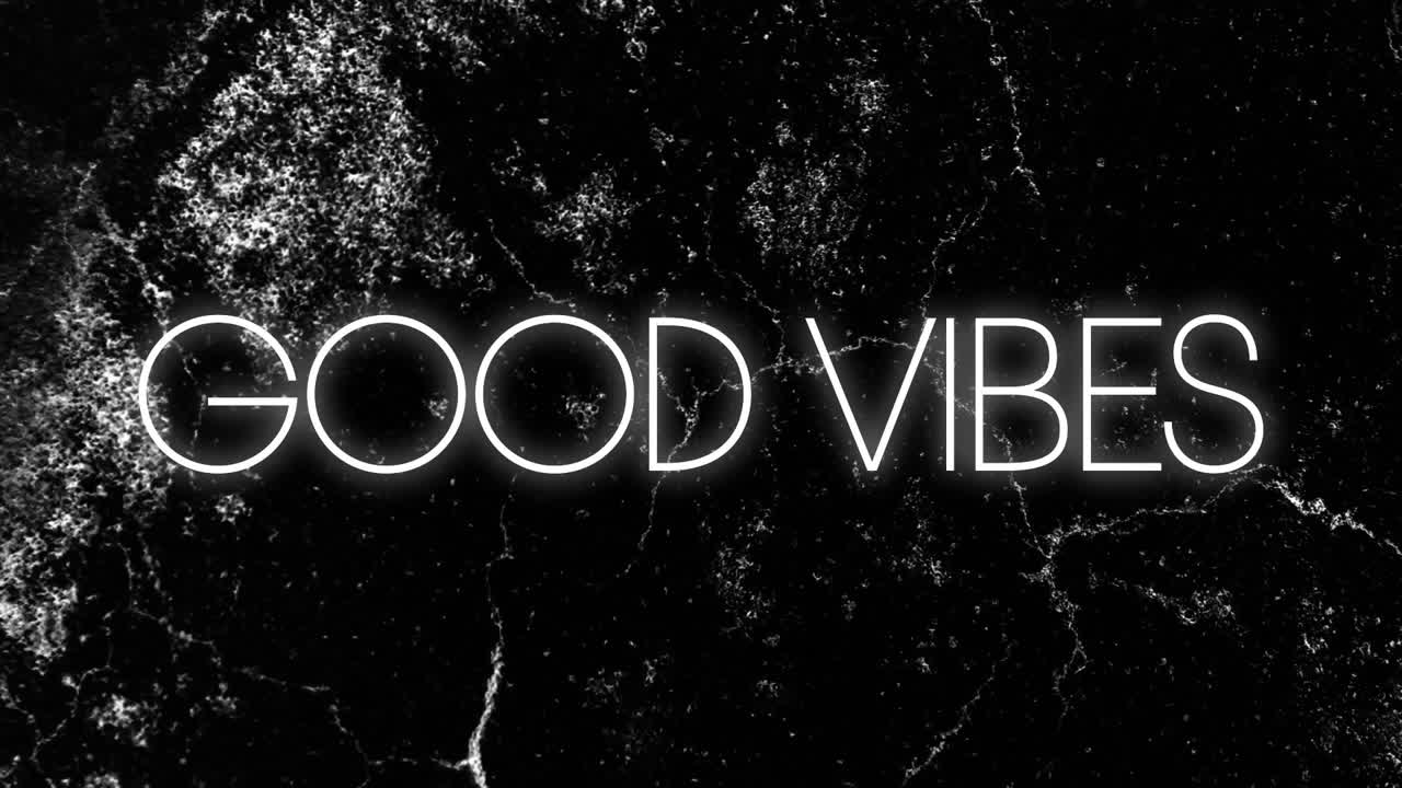Good Vibes text animation over black marble background