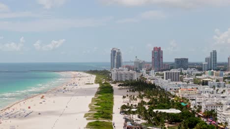tropical beach and skyline of miami city, high altitude aerial view