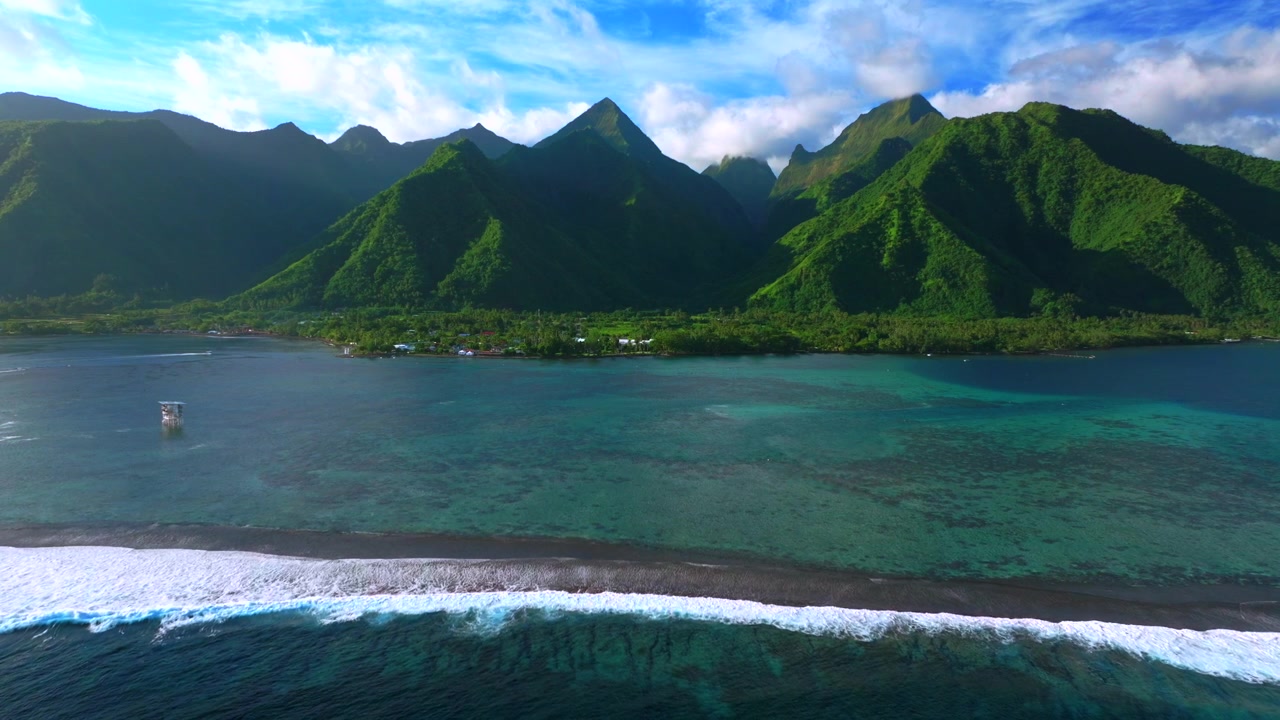 Teahupo'o surf waves WSL judge tower surf tour boats South Pacific Ocean coral reef aerial drone Tahiti French Polynesia island sunny blue sky lagoon surfing Passe Havea harbor landscape static