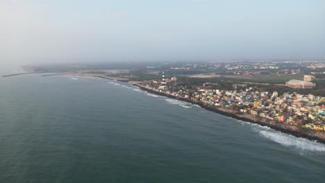 drone footage approaching city from sea