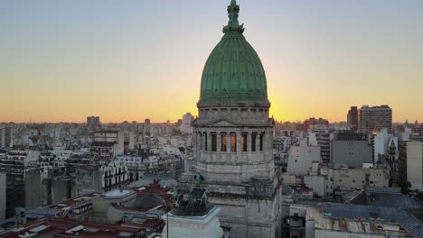 Cinematic-aerial-orbiting-view-of-the-National-Congress-dome-at-sunset