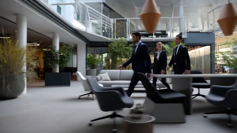 business professionals walking in a modern office lobby