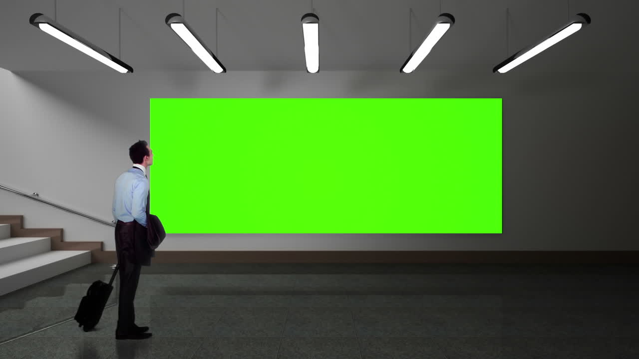 녹색 화면을 보는 사업가