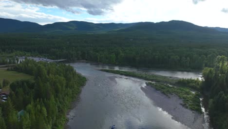 Timelapse-Of-A-Raft-Boat-On-Flathead-River-With-Cloud-Reflections-In-Montana,-United-States