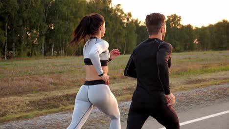 couple running outdoors at sunset