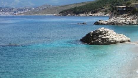 stunning Pulebardha Beach in Ksamil, Albania. Saranda city on background