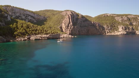 white sailboat in dreamy blue lagoon