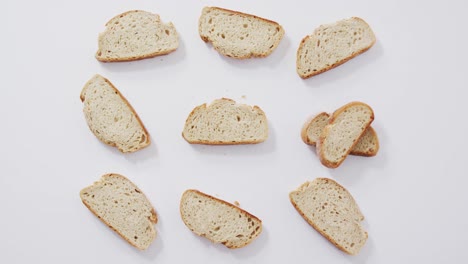 video of slices of bread seeing from above on white background